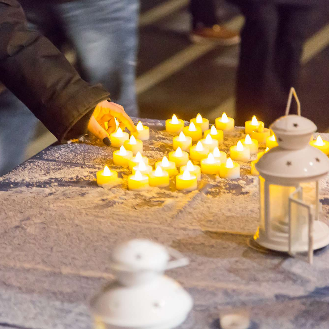 Instagram 4 A person placing a tea light on a table