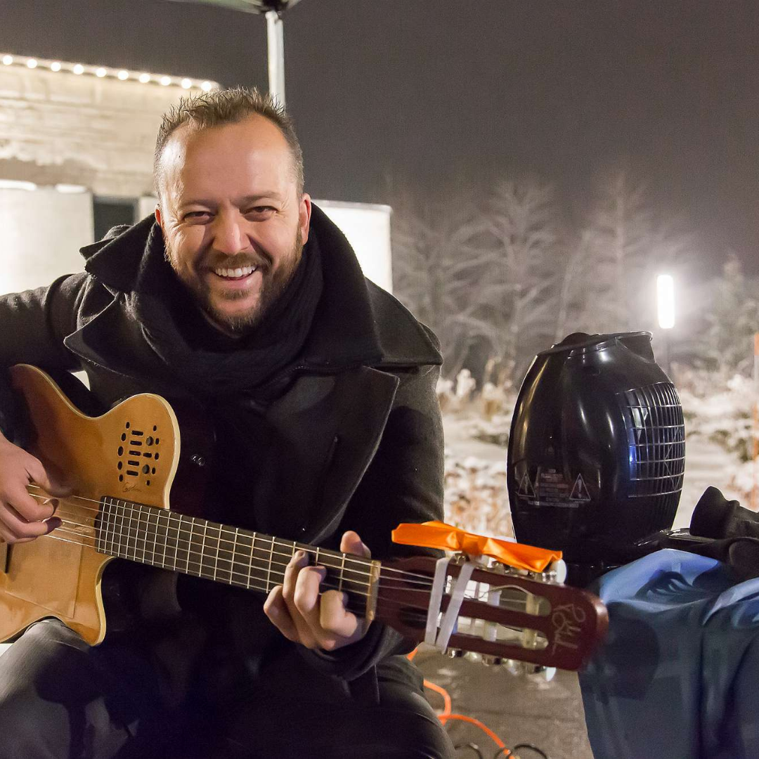Instagram 6 Juneyt Yetkiner, Flamenco Guitar Player, smiling at the Lights of Love event