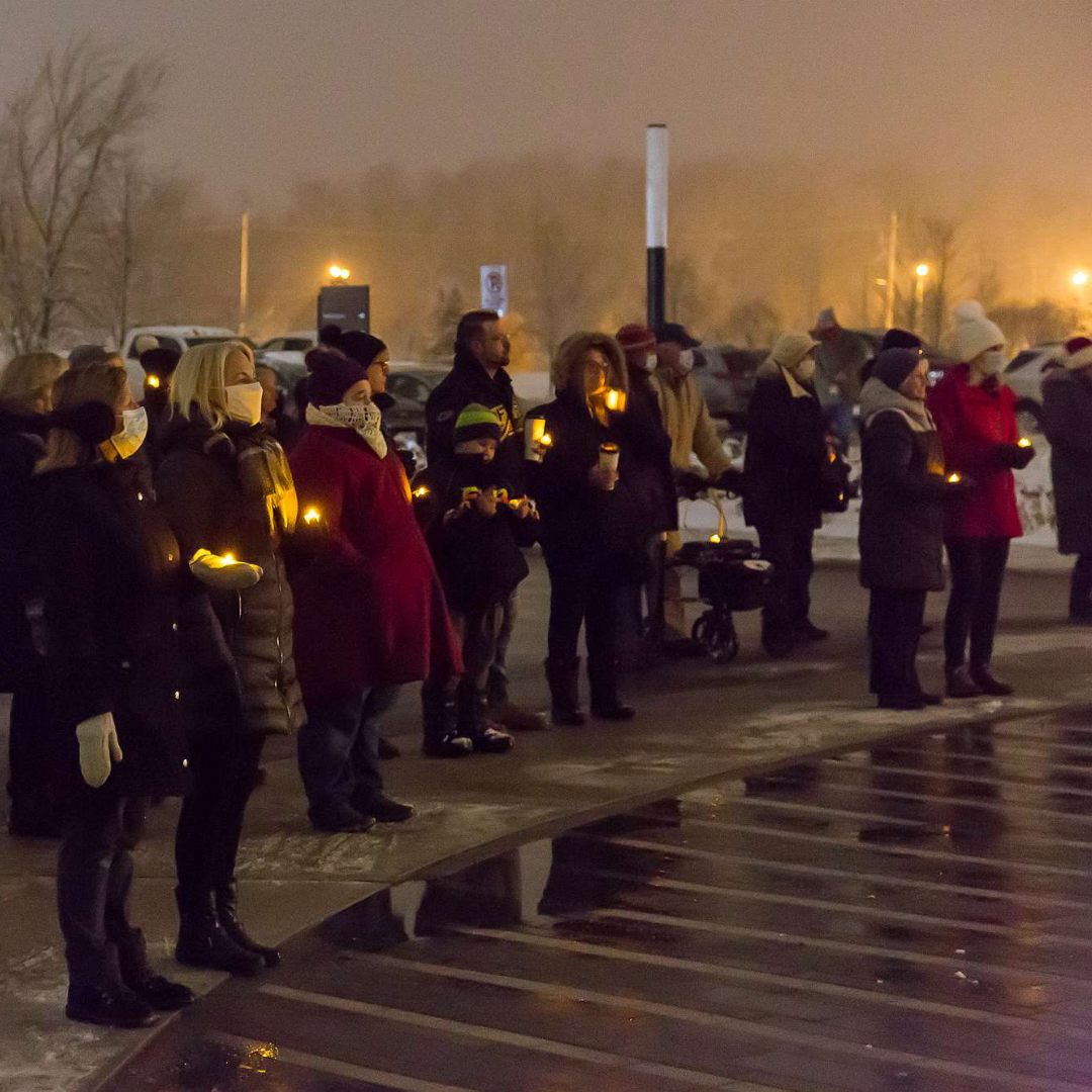 A crowd gathered around the front entrance of The Gies Family Centre