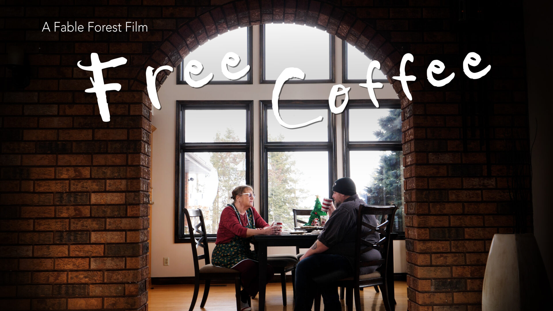 Promotion poster for Free Coffee, featuring a man and woman seated at a table