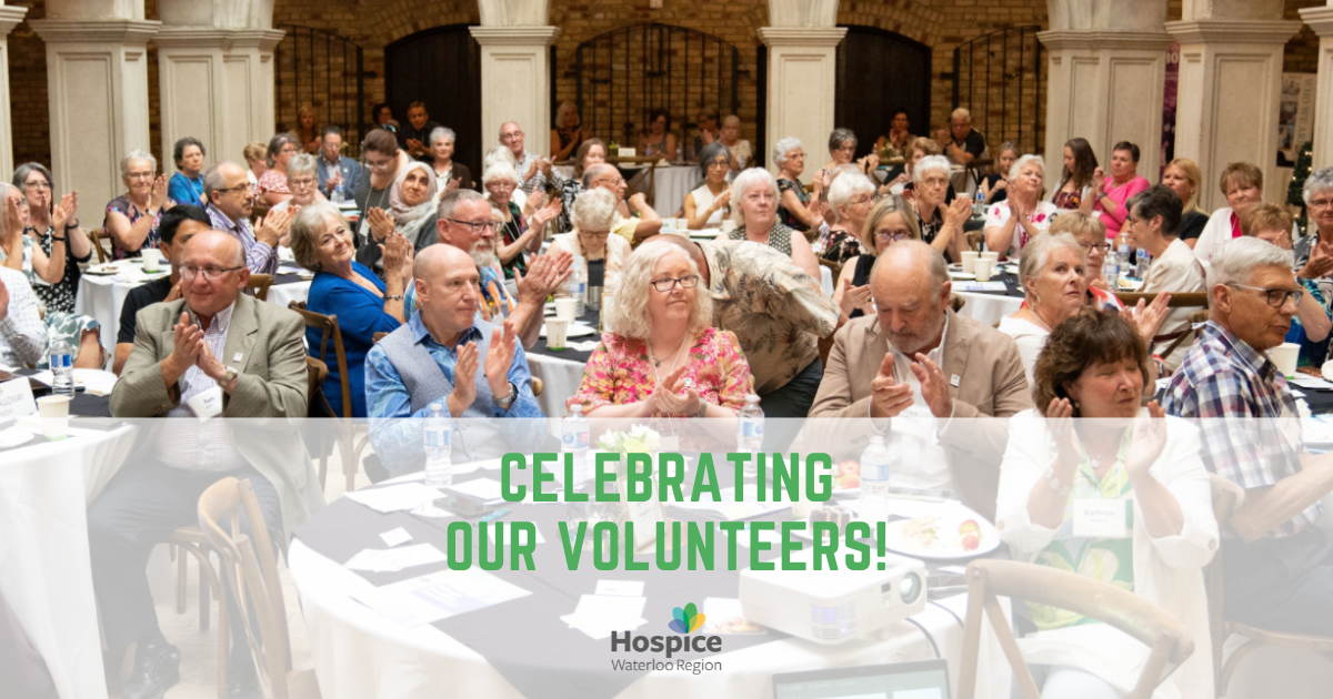 Blog cover image - Celebrating our volunteers. It features a photo of a large group of people clapping.