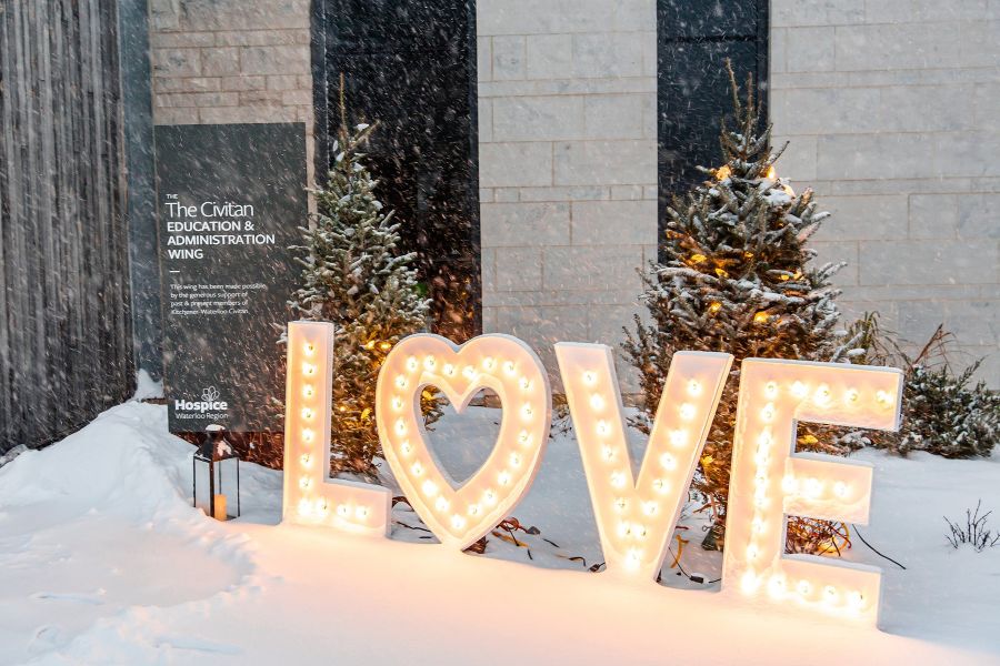 Man holding a candle at a vigil